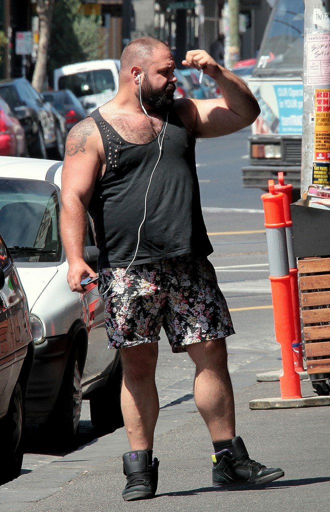 Man in the street wearing a flower boxer shorts Melbourne City Australia