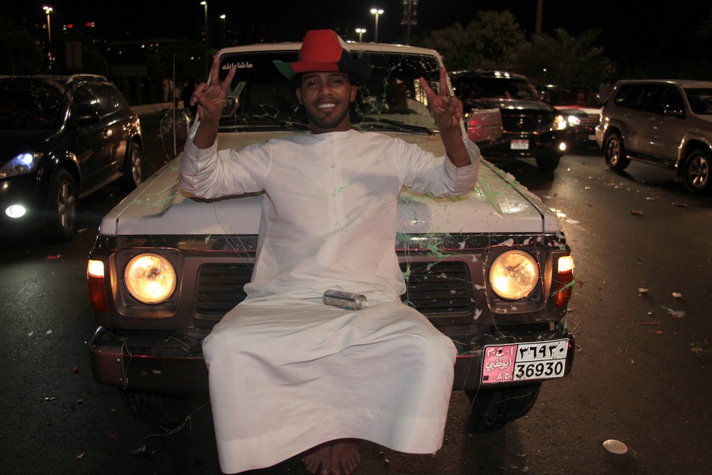 man sit on the front of is car national day abu dhabi corniche 40h anniversary 