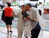 Female reporter Japanese girl tv typhoon Man-Yi Japan Tokyo Shinjuku quarter