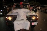 man sit on the front of is car national day abu dhabi corniche 40h anniversary 