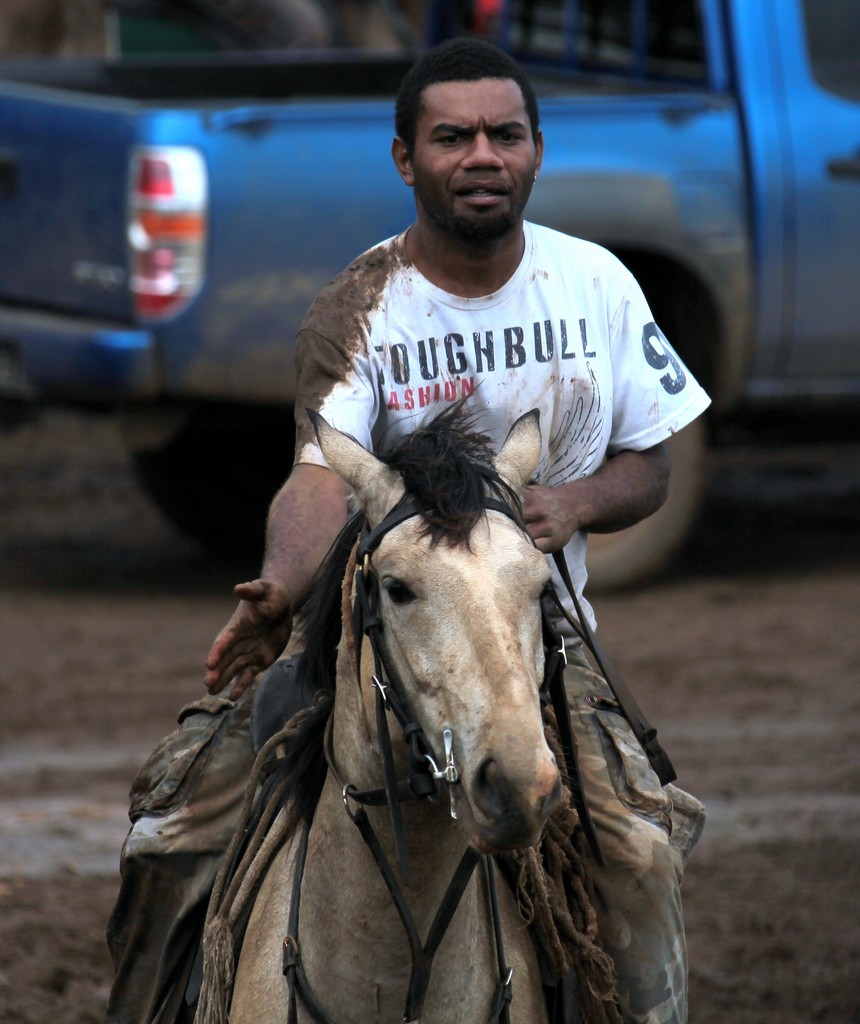 Black men on a horse New Caledonia Rodeo cowboy stockman