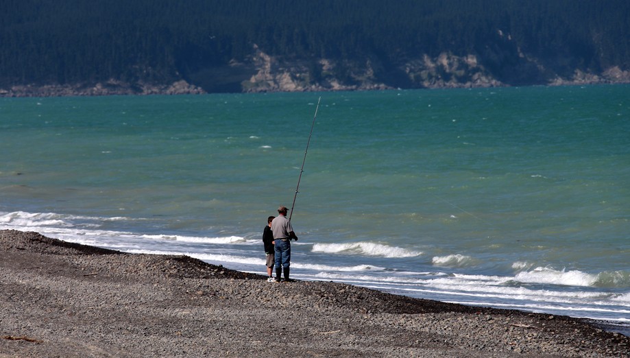 father and son fishing in new zealand south island