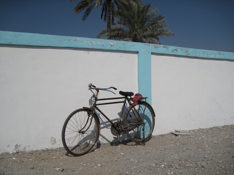 Bike on the wall Dibba town pictures Sultanate of Oman