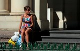 Street legs woman waiting the metro with bags sexy colour dress Melbourne City Australia