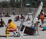 Lifeguard supervises the safety and rescue of swimmers, surfers Abu Dhabi beach